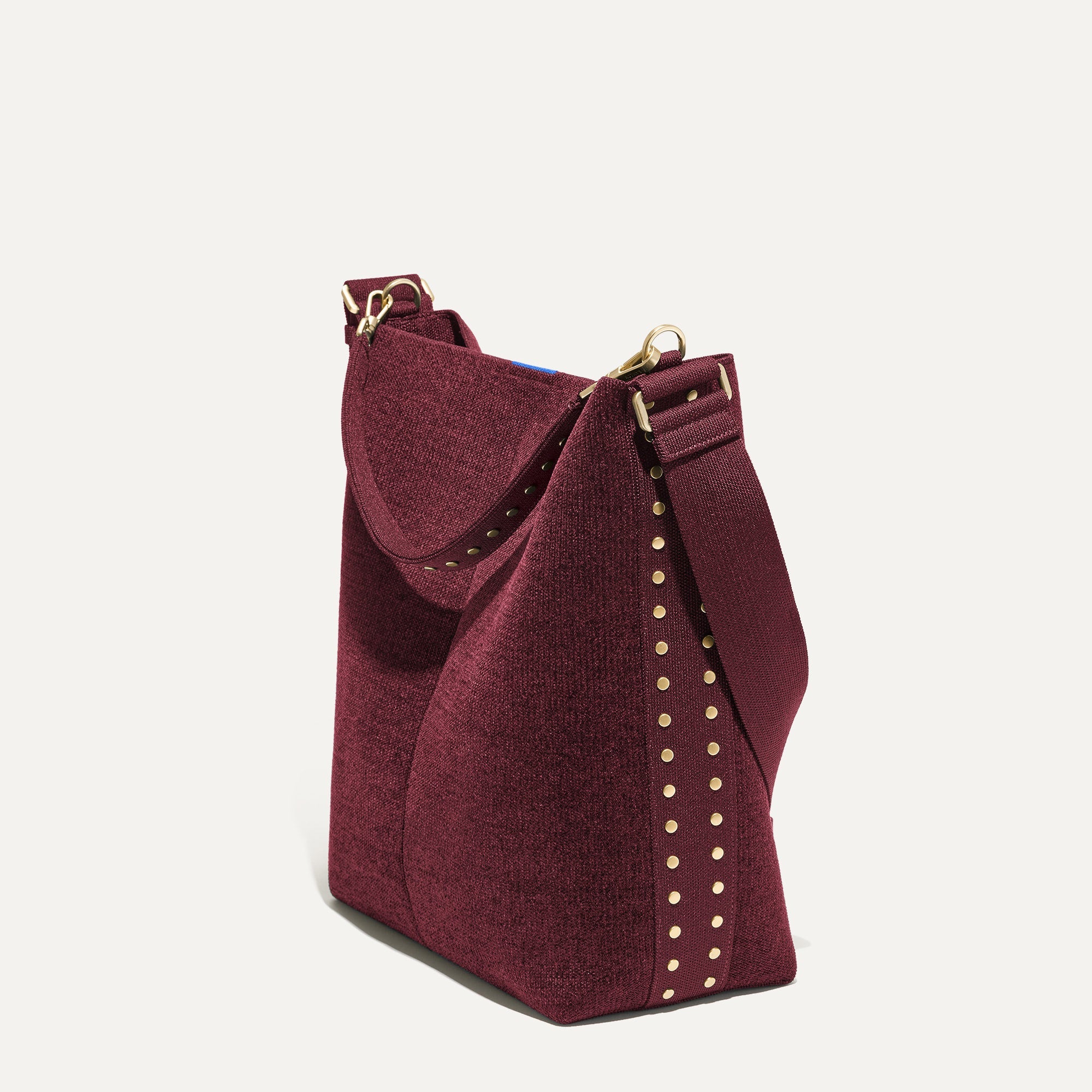 358_ReVelvet_Bucket_Bag_ReVelvet_Syrah_Studded_45_Degree_9365_af705151-51aa-45a3-9446-5b47dba6c06a.jpg